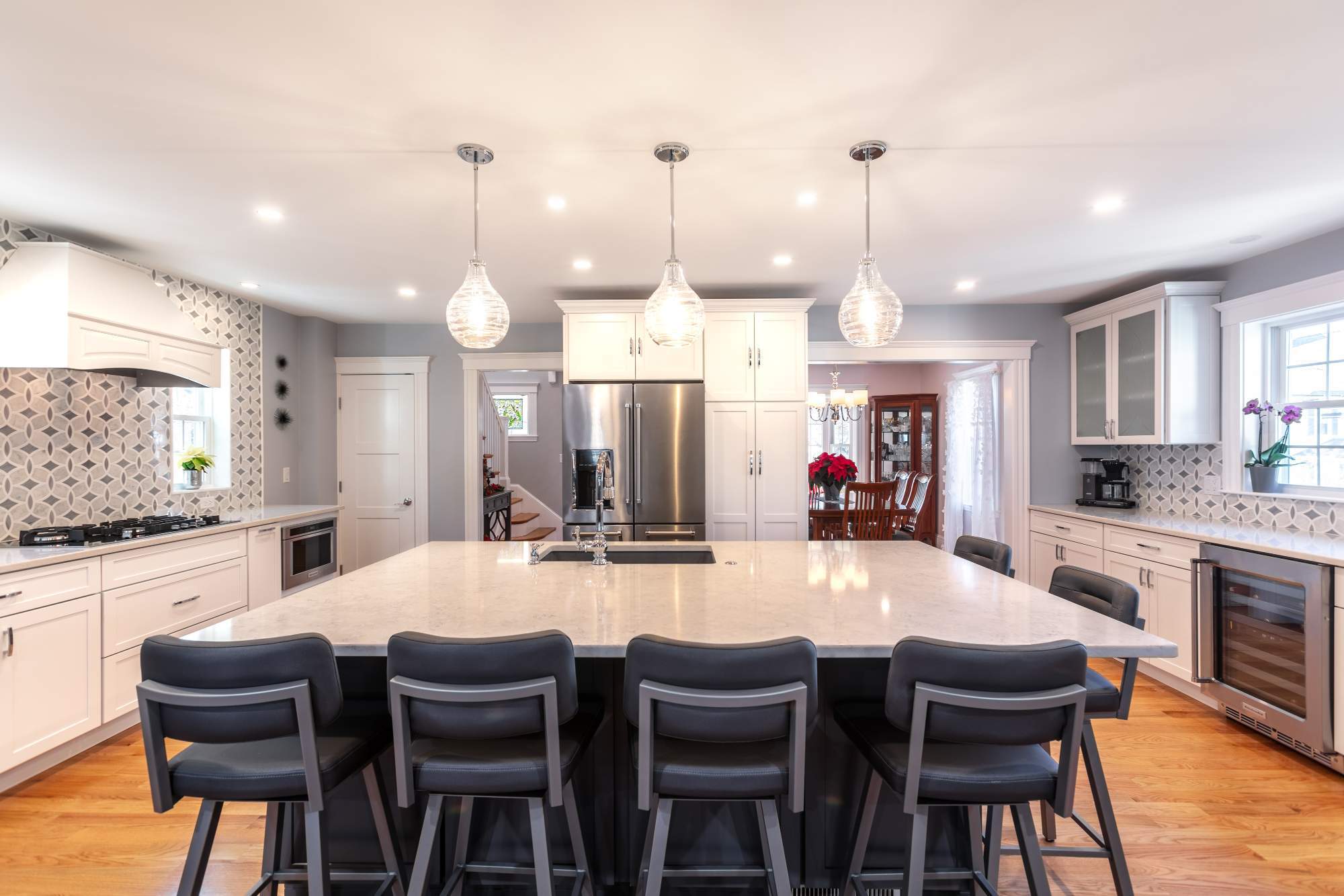 Updated kitchen in Melrose, MA by Pegasus Design-to-Build featuring quartz countertops and modern cabinetry-optimized