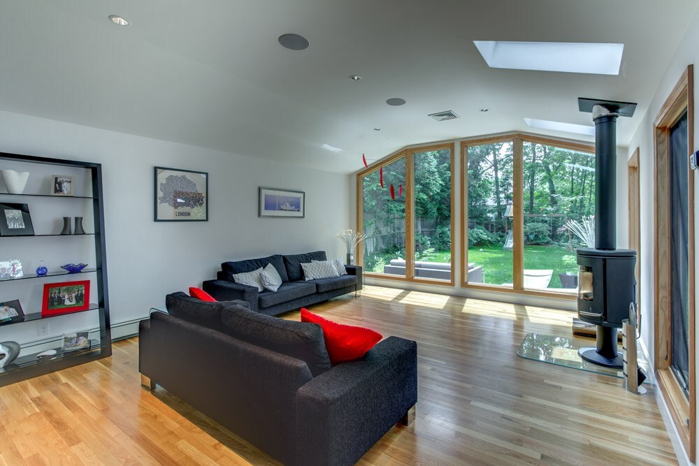 bright living area with large windows in open kitchen renovation by PEGASUS Design-to-Build in Arlington, MA