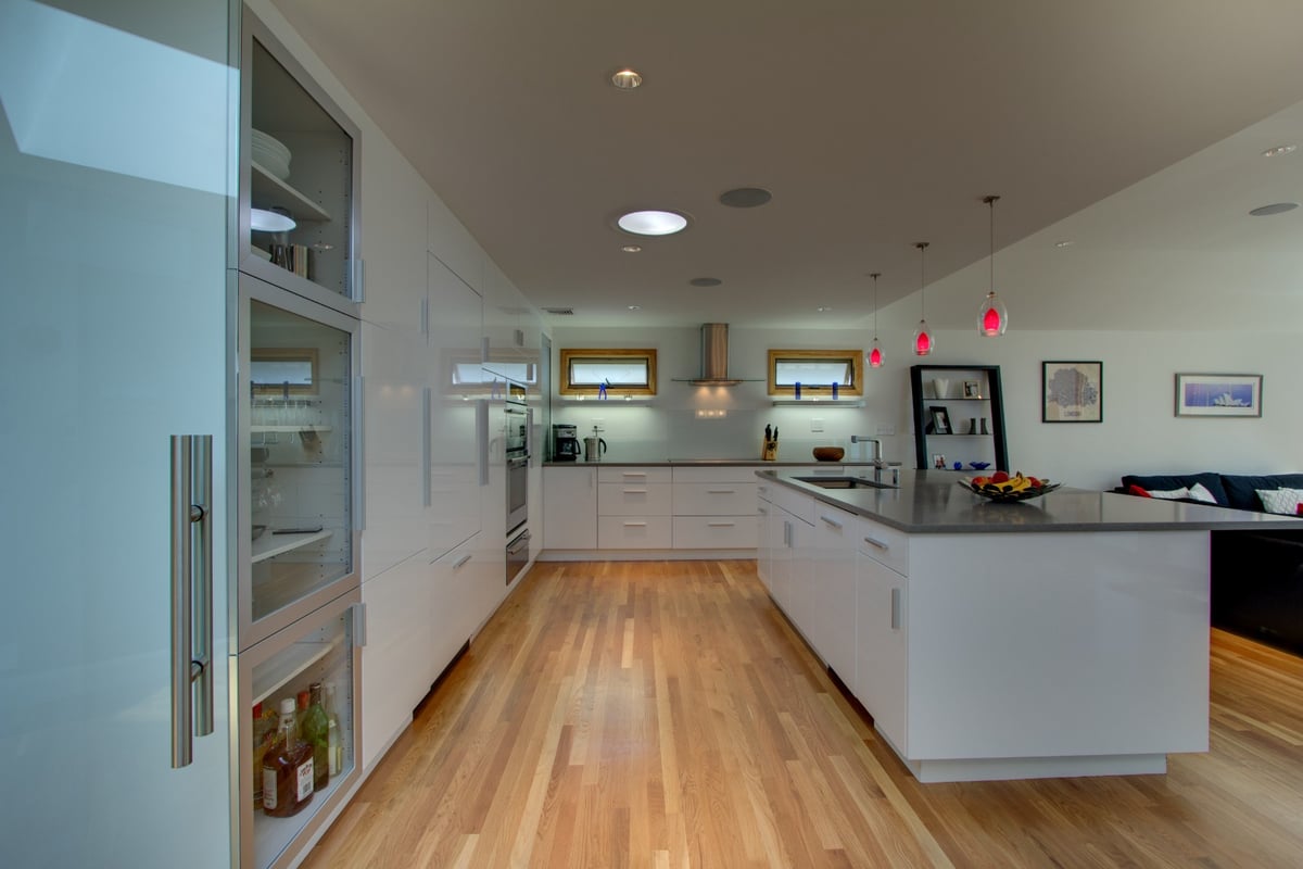 minimalist kitchen design with hardwood flooring and clean lines by PEGASUS Design-to-Build in Arlington, MA-optimized