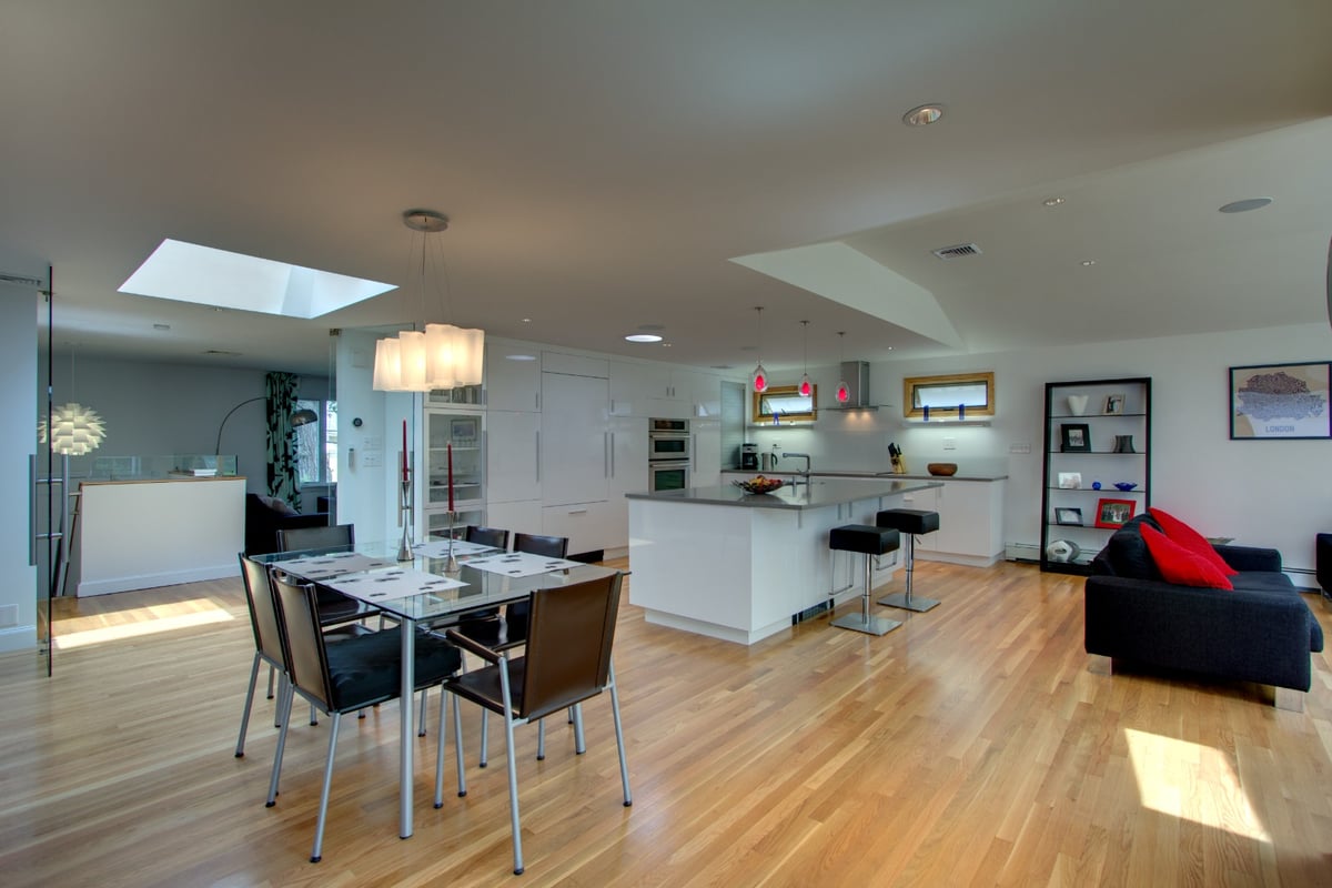 open-concept kitchen and dining remodel with skylight and island by PEGASUS Design-to-Build in Arlington, MA-optimized