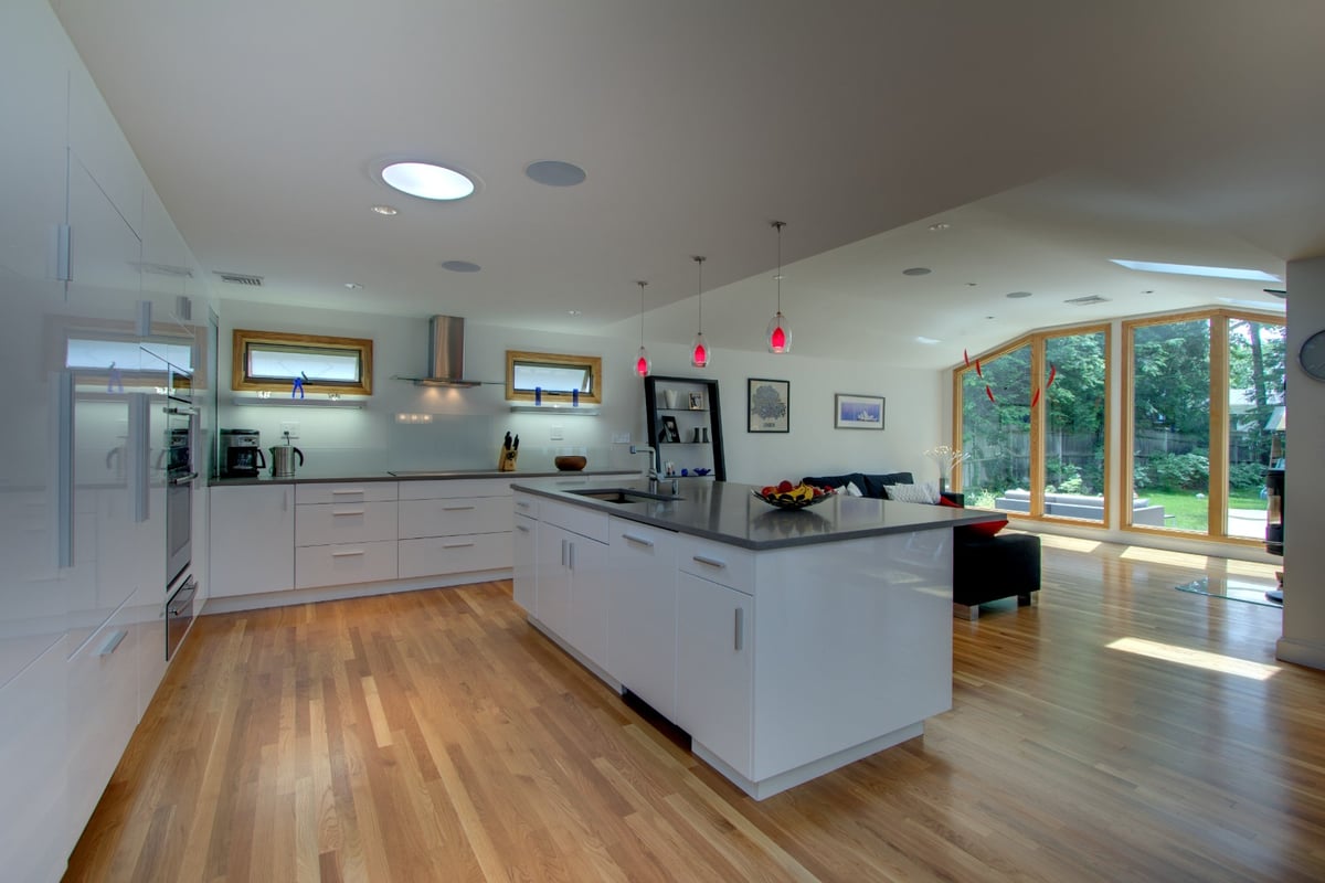 spacious kitchen remodel with large island and open living area by PEGASUS Design-to-Build in Arlington, MA-optimized