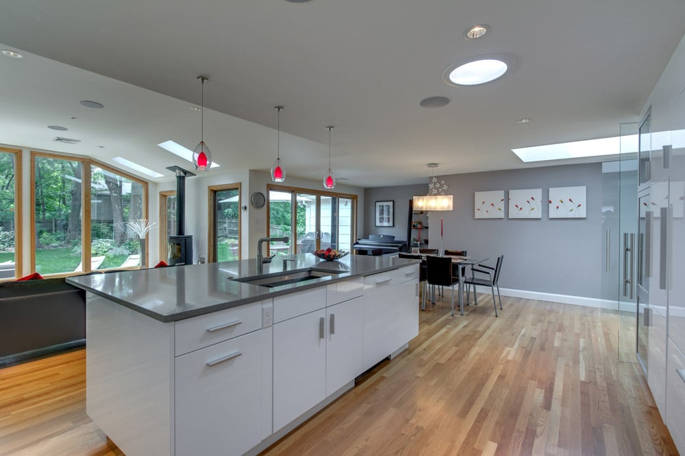 spacious kitchen renovation with modern island and seating area by PEGASUS Design-to-Build in Arlington, MA
