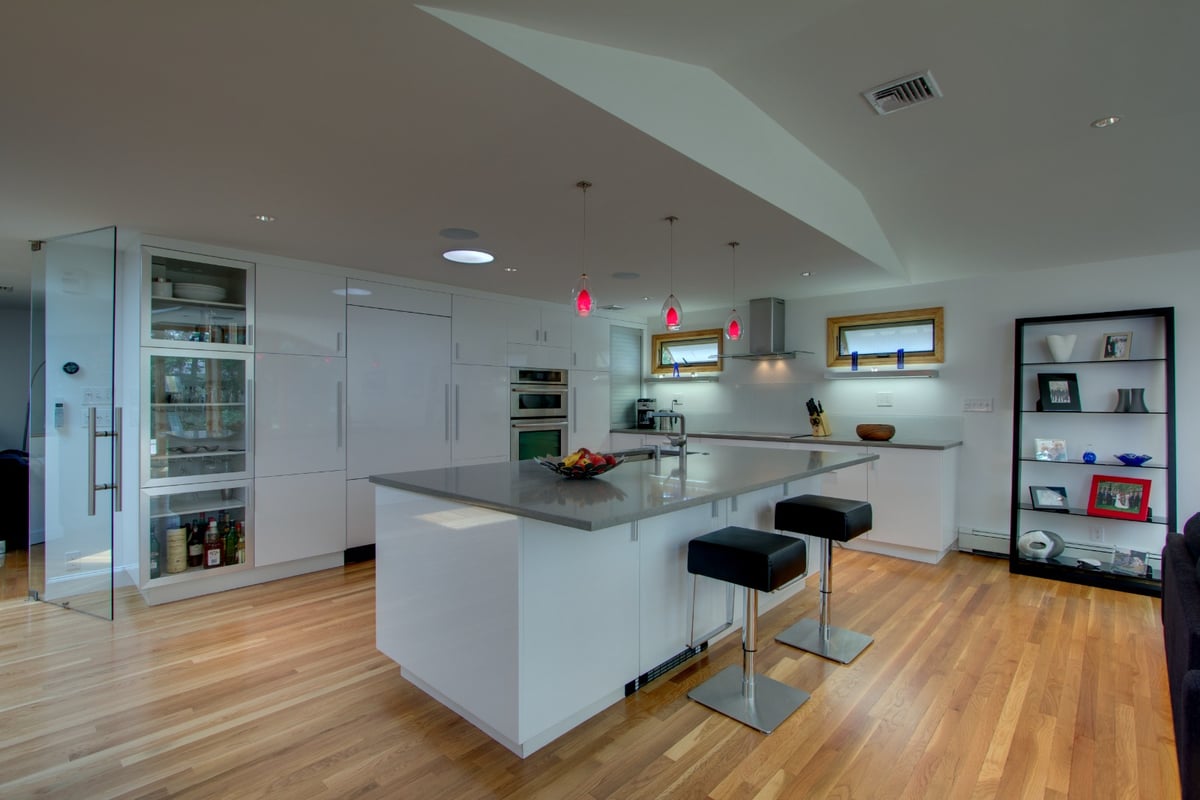 white kitchen renovation with open layout and custom cabinetry by PEGASUS Design-to-Build in Arlington, MA-optimized
