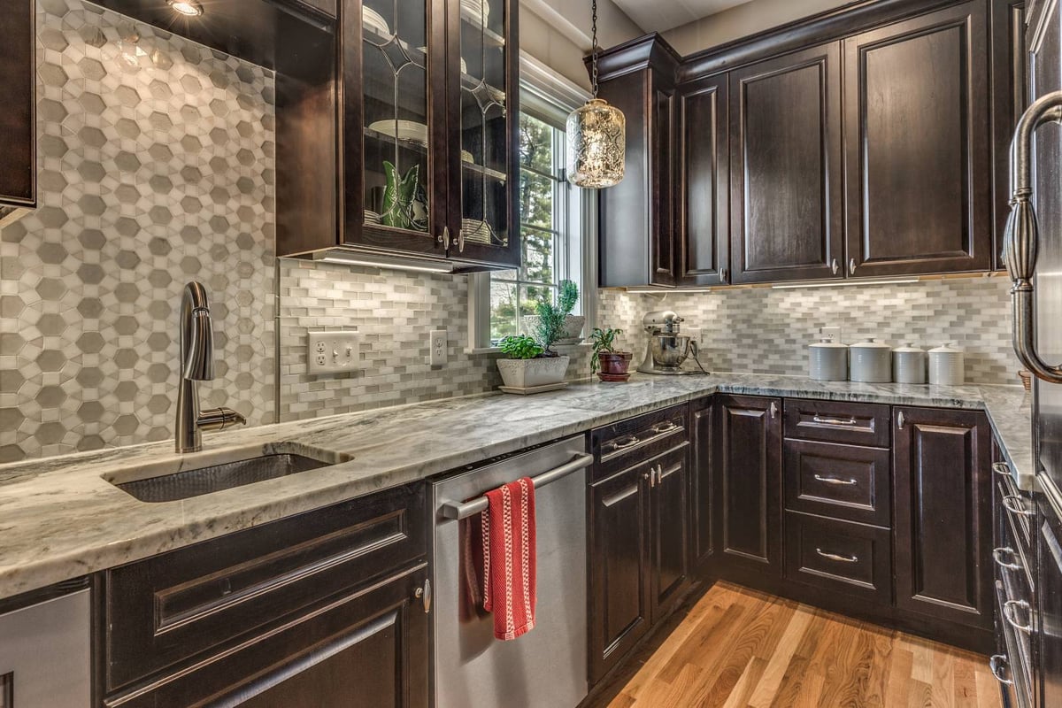 Butler’s pantry kitchen addition in Winchester, MA by Pegasus Design-to-Build with dark wood cabinets and stone countertops-optimized