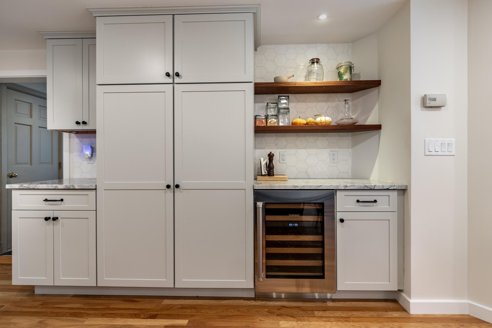 Triple-tier custom cabinets and built-in wine fridge in kitchen remodel in Winchester by PEGASUS Design-To-Build Triple-tier custom cabinets and built-in wine fridge in kitchen remodel in Winchester by PEGASUS Design-To-Build