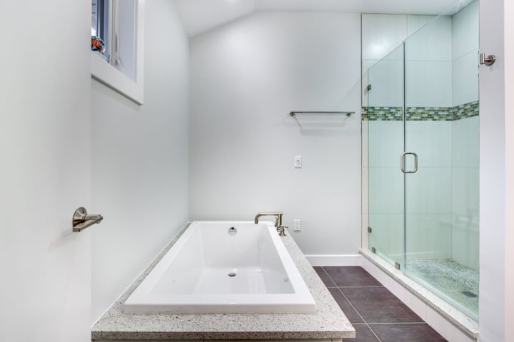 bathroom addition featuring soaking tub and glass enclosed shower by PEGASUS Design-to-Build in Lexington, MA