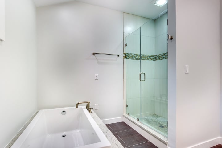 modern bathroom addition with soaking tub and glass shower by PEGASUS Design-to-Build in Lexington, MA