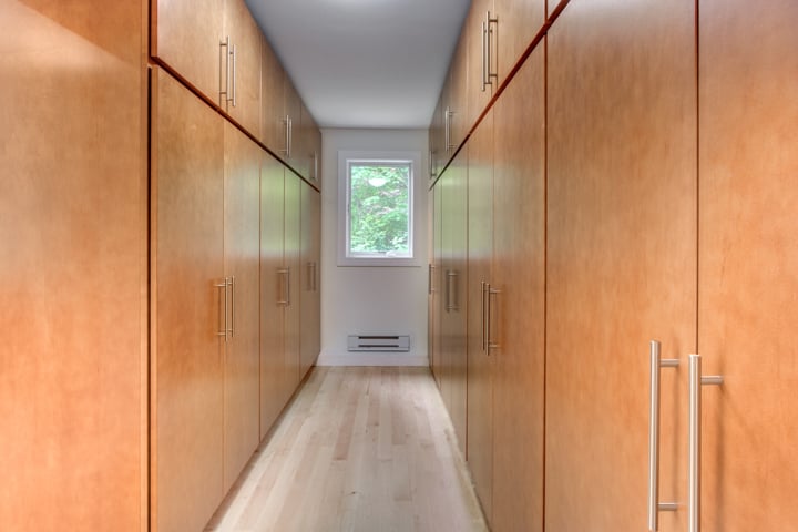 narrow pantry hallway with custom wood cabinetry and storage by PEGASUS Design-to-Build in Lexington, MA