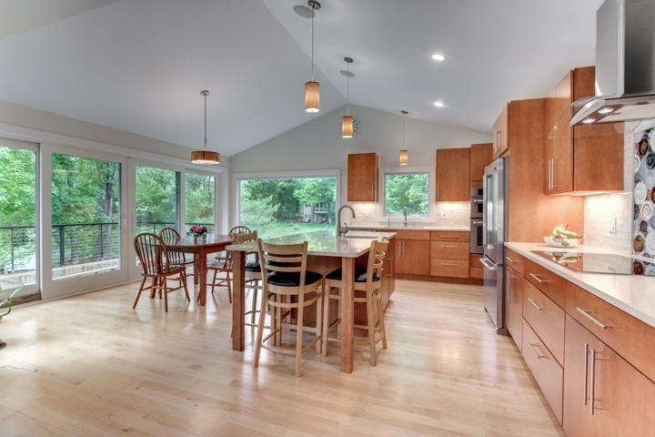 open kitchen addition with dining area and large windows by PEGASUS Design-to-Build in Lexington, MA-optimized