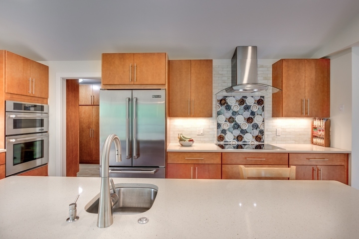 open kitchen design with wood cabinets and quartz countertops by PEGASUS Design-to-Build in Lexington, MA-optimized