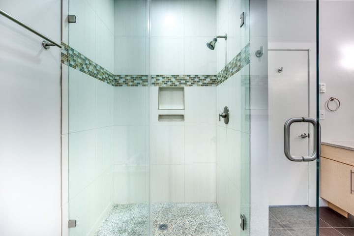 walk-in glass shower with tile accents in bathroom addition by PEGASUS Design-to-Build in Lexington, MA