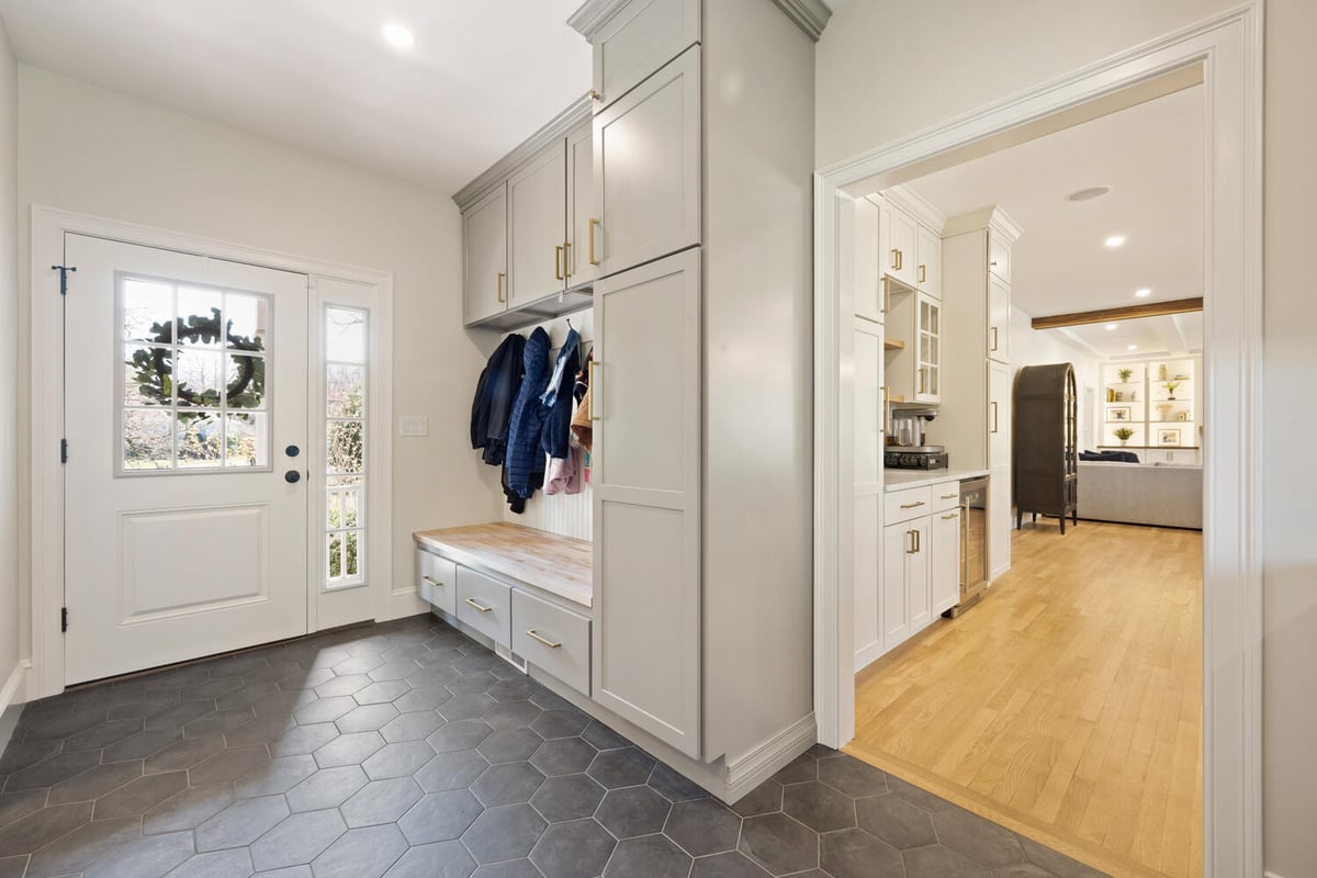custom mudroom with built-in bench seating and storage cabinetry by PEGASUS Design-to-Build in Lexington, MA