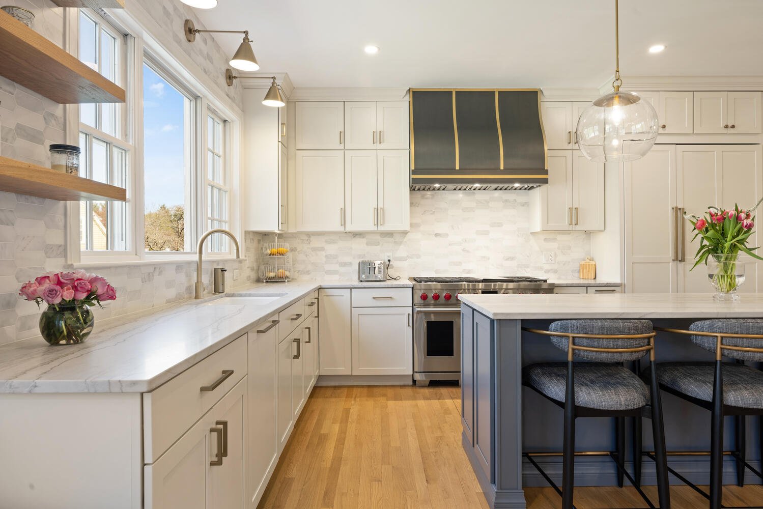 Detailed kitchen view with range hood and backsplash design by PEGASUS Design-to-Build in Lexington, MA