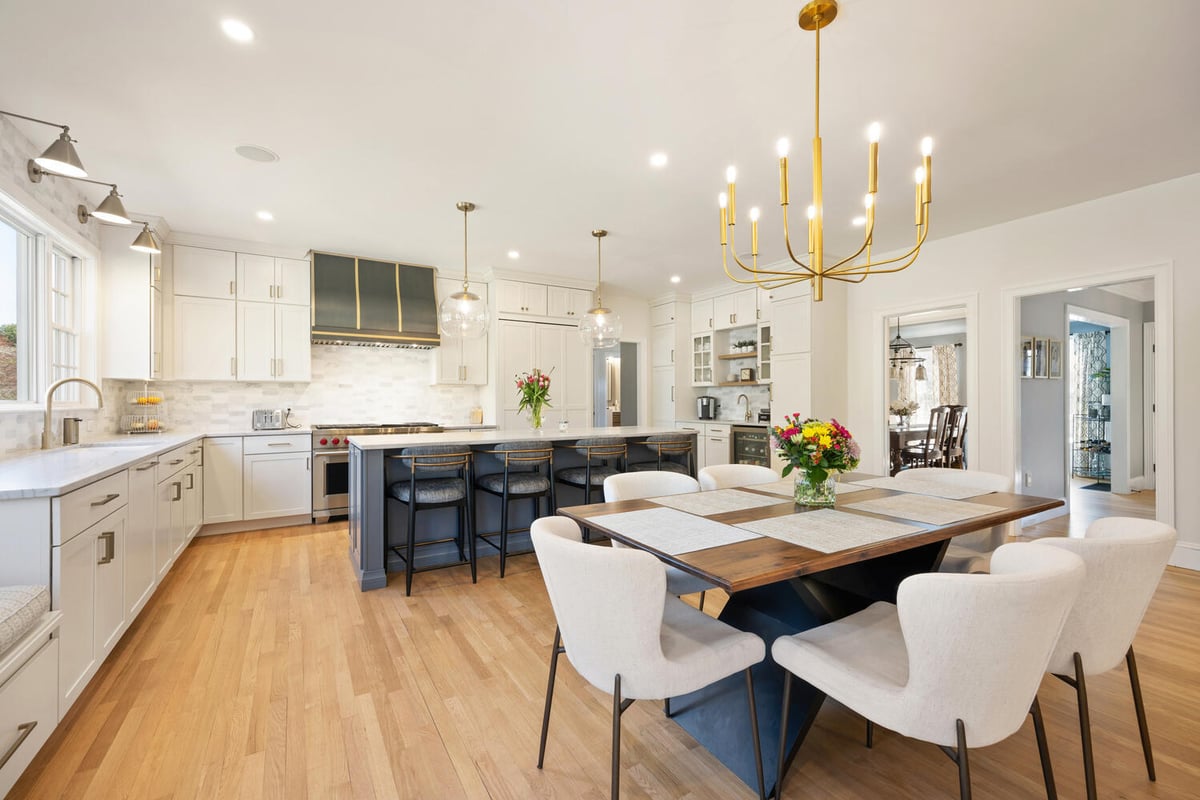 wide view of kitchen addition with island and dining area by PEGASUS Design-to-Build in Lexington, MA