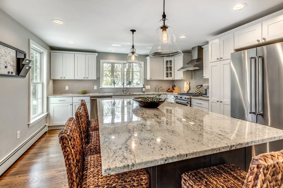 Close-up of kitchen island renovation in Lexington, MA by PEGASUS Design-to-Build featuring stone countertops and seating-optimized