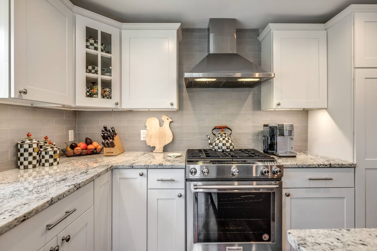 Kitchen range and cabinetry remodel in Lexington, MA by PEGASUS Design-to-Build with stainless steel appliances-optimized