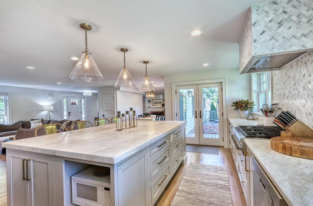 Contemporary kitchen remodel in Melrose, MA by PEGASUS Design-to-Build featuring a central island and open floor plan.-optimized