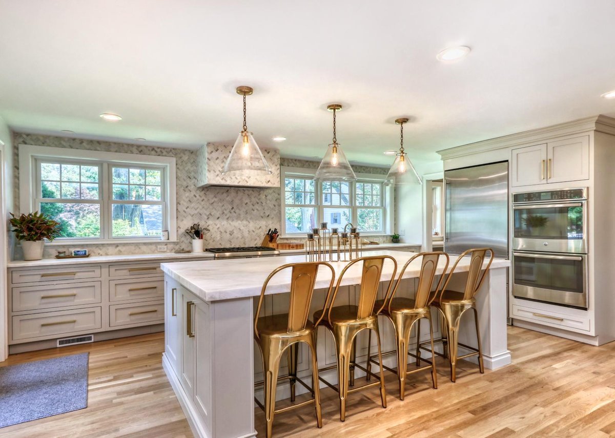 Contemporary kitchen renovation in Melrose, MA by PEGASUS Design-to-Build featuring bar seating and custom cabinetry.-optimized
