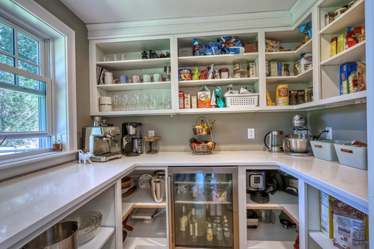 Custom pantry renovation in Melrose, MA by PEGASUS Design-to-Build with open shelving and built-in storage.-optimized