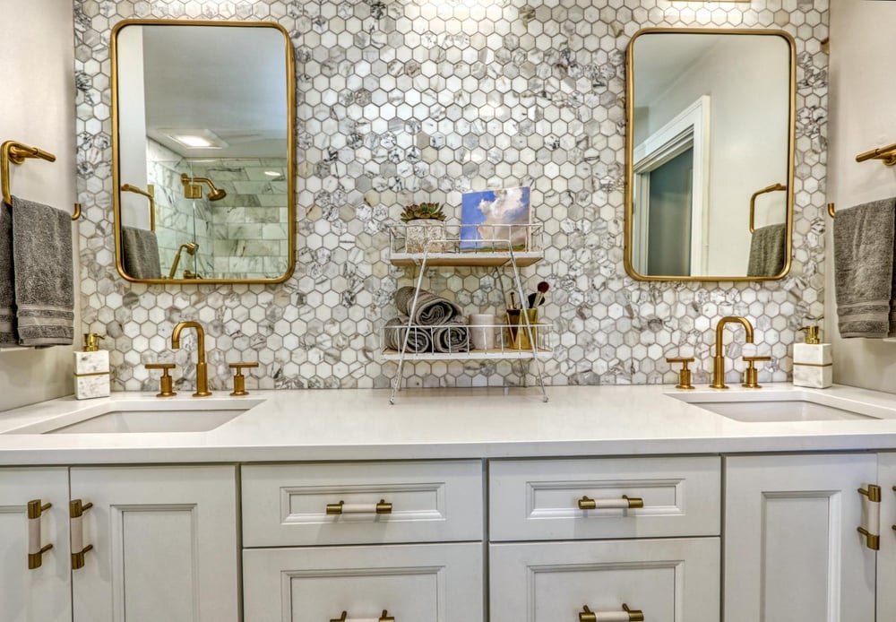 Double vanity bathroom remodel in Melrose, MA by PEGASUS Design-to-Build with hex tile backsplash and gold accents.-optimized