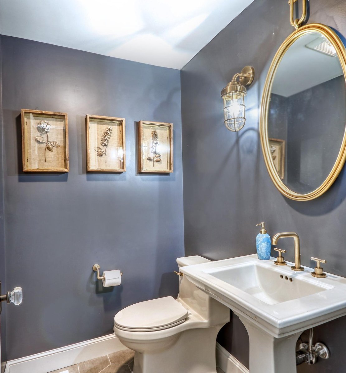 Small bathroom renovation in Melrose, MA by PEGASUS Design-to-Build featuring bold wall color and brass lighting.-optimized