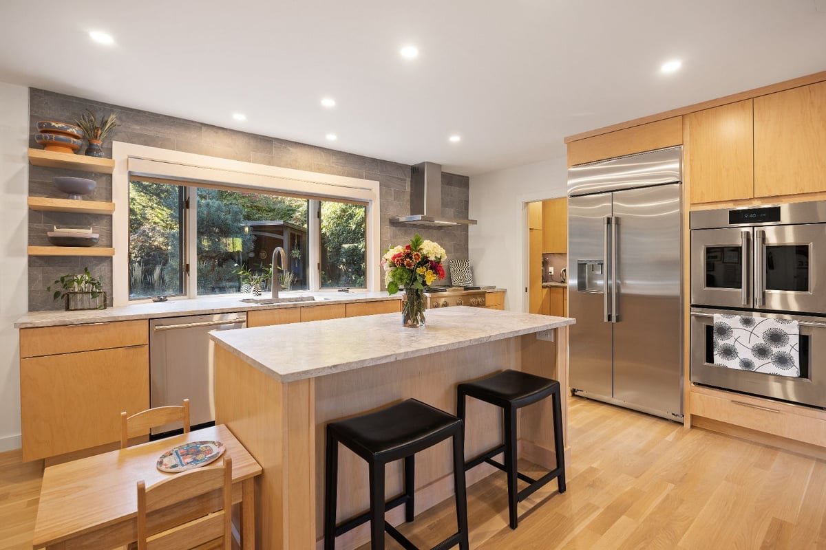 Kitchen island with quartz countertops and modern cabinetry by PEGASUS Design-to-Build in Melrose, MA kitchen and addition renovation-optimized