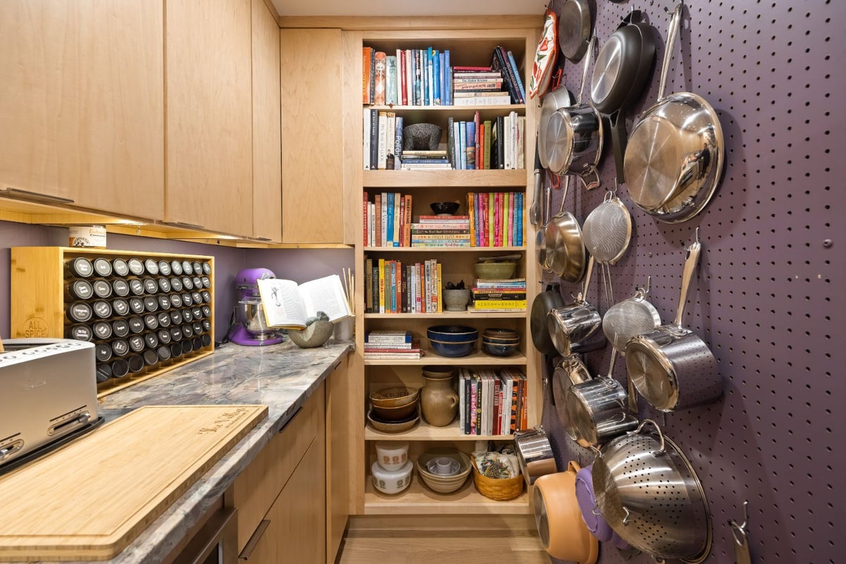 Organized pantry space with storage and cookware display by PEGASUS Design-to-Build in Melrose, MA kitchen and addition renovation-optimized