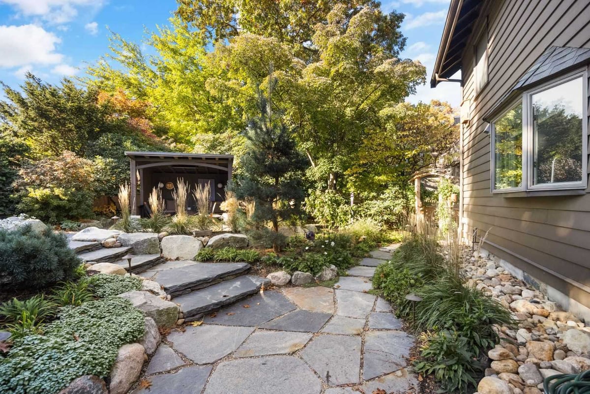 Outdoor living space with natural stone walkway and plantings by PEGASUS Design-to-Build in Melrose, MA kitchen and addition renovation-optimized