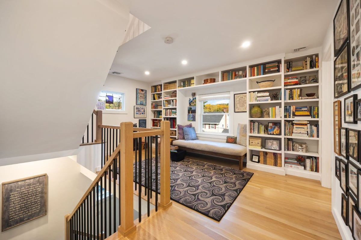 Upstairs reading nook with built-in bookshelves by PEGASUS Design-to-Build in Melrose, MA kitchen and addition renovation-optimized