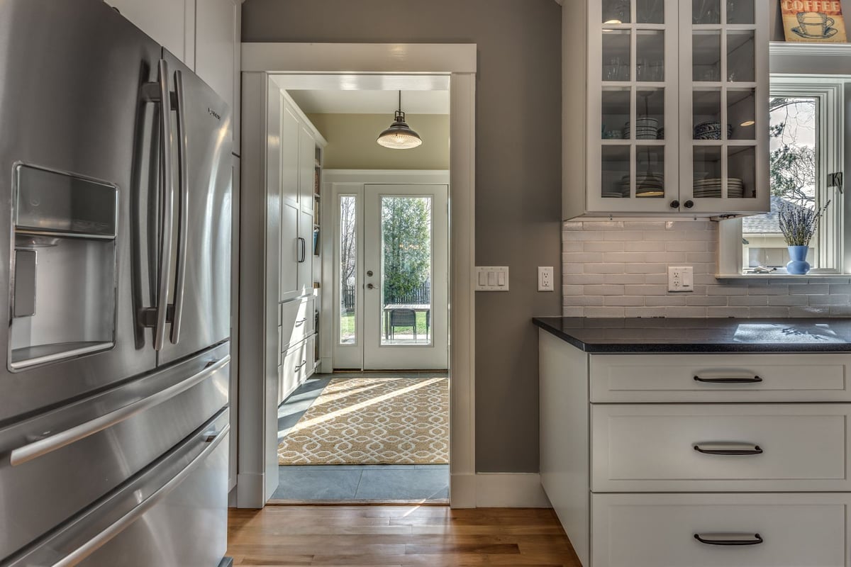 Mudroom entry connected to kitchen remodel in Melrose MA by PEGASUS Design-to-Build with built-in storage-optimized