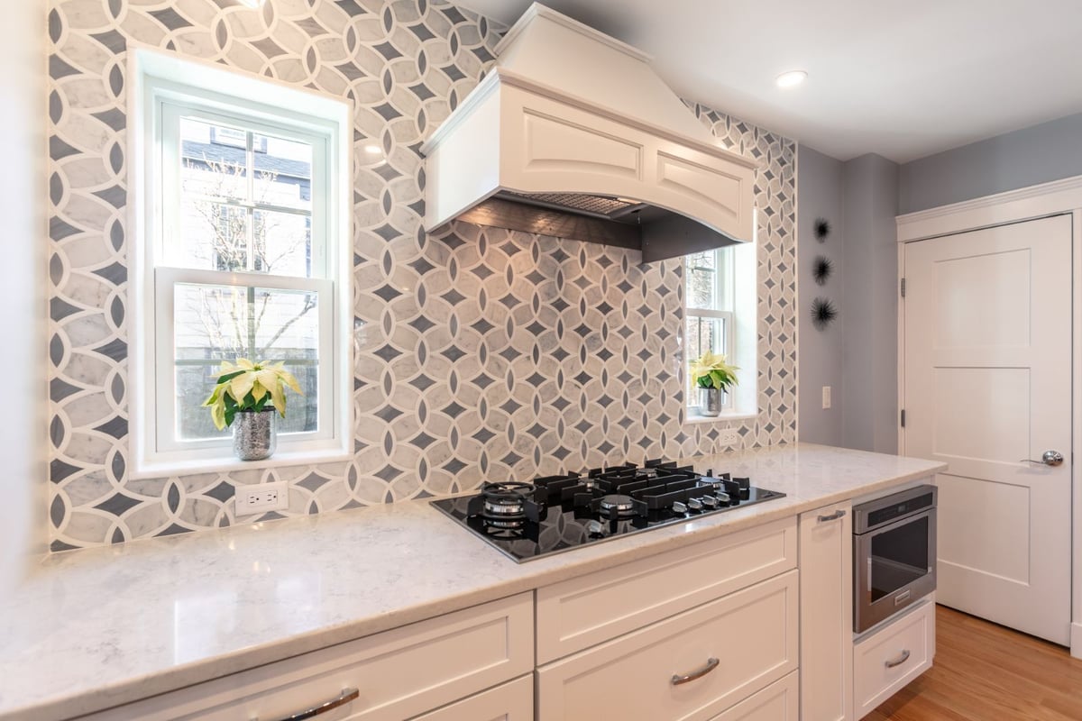 close-up of kitchen cooking area with decorative tile in Melrose MA by PEGASUS Design-to-Build-optimized