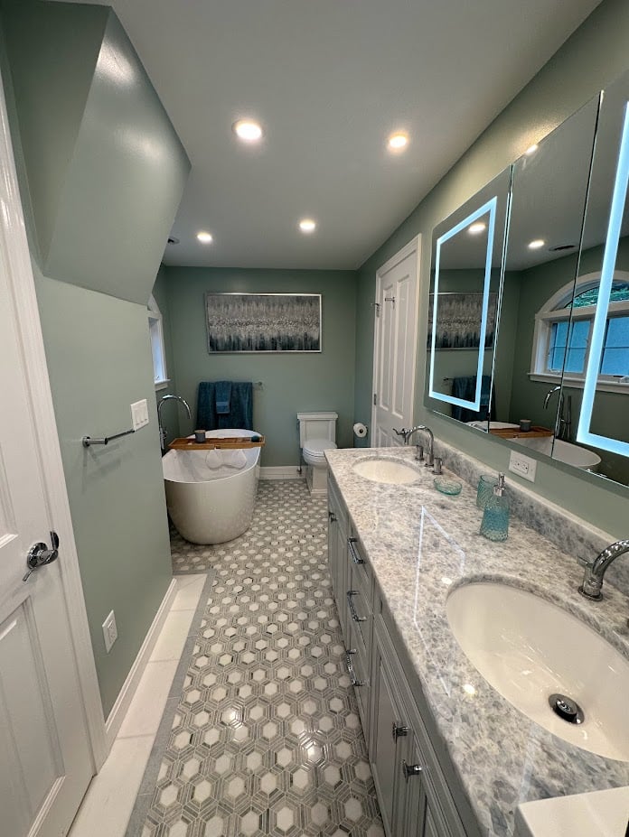 double vanity bathroom with freestanding tub in whole house renovation by PEGASUS Design-to-Build in Melrose MA