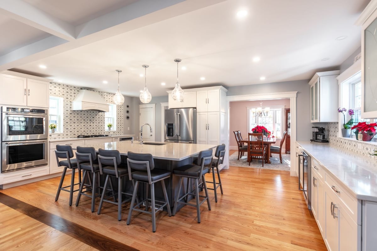 open concept kitchen with large island and pendant lighting in Melrose MA by PEGASUS Design-to-Build-optimized