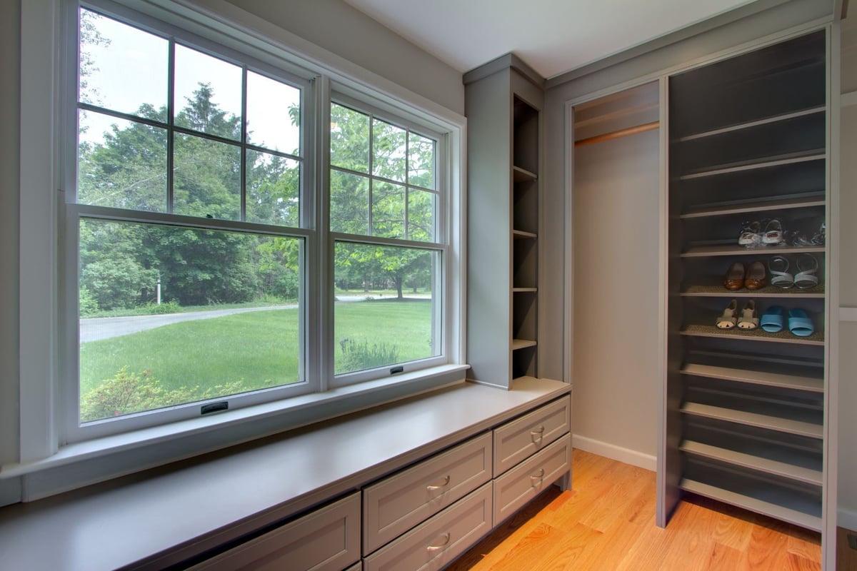 Open living room with large windows and hardwood flooring in North Shore MA by PEGASUS Design-to-Build-optimized