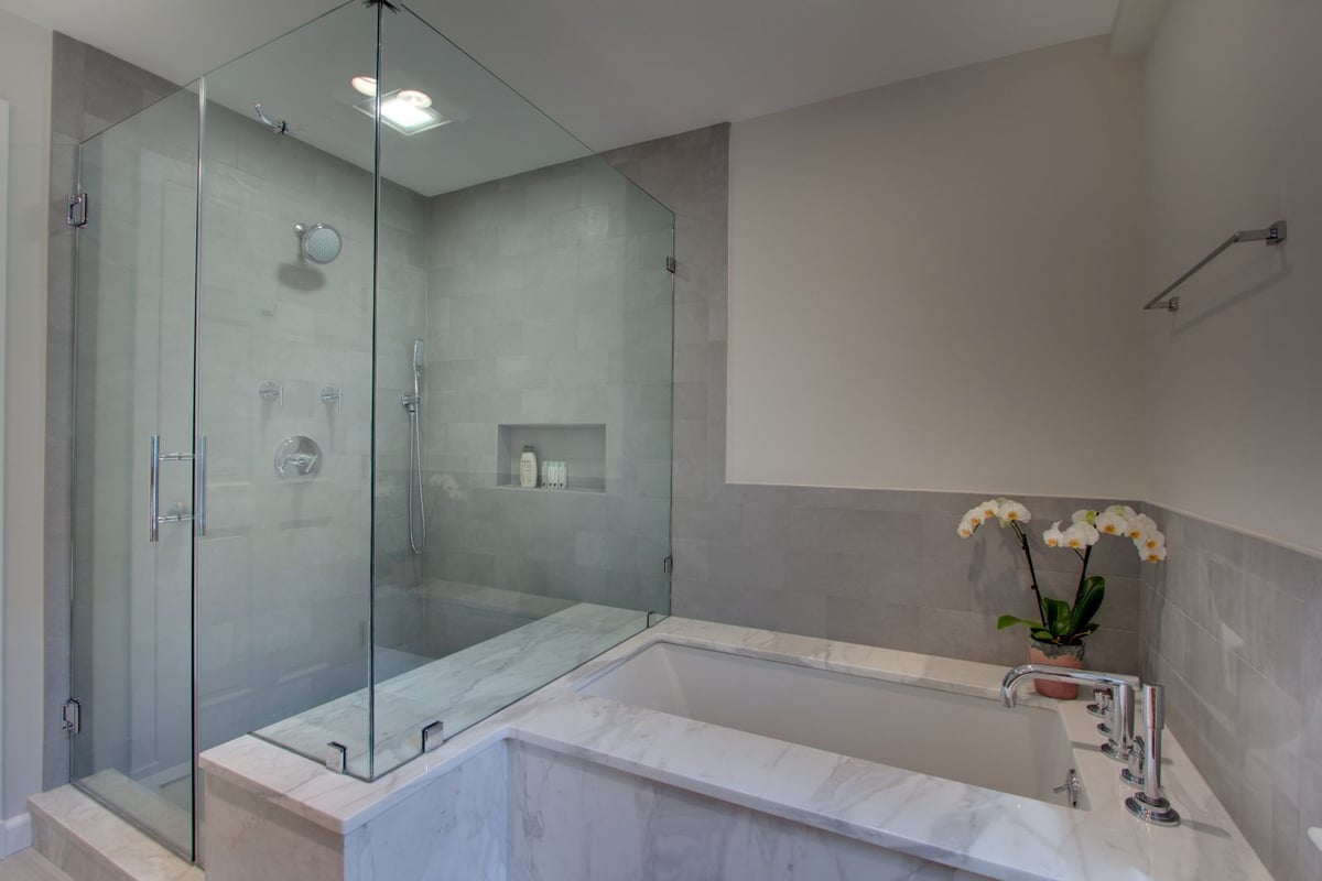 Stylish bathroom remodel with tiled shower walls and soaking tub in North Shore MA by PEGASUS Design-to-Build-optimized