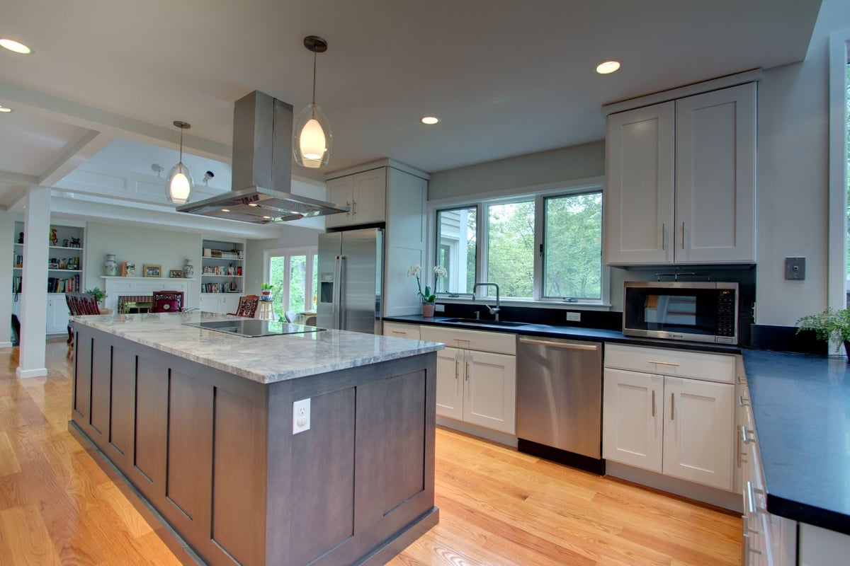 Updated kitchen design featuring island seating and modern finishes in North Shore MA by PEGASUS Design-to-Build-optimized