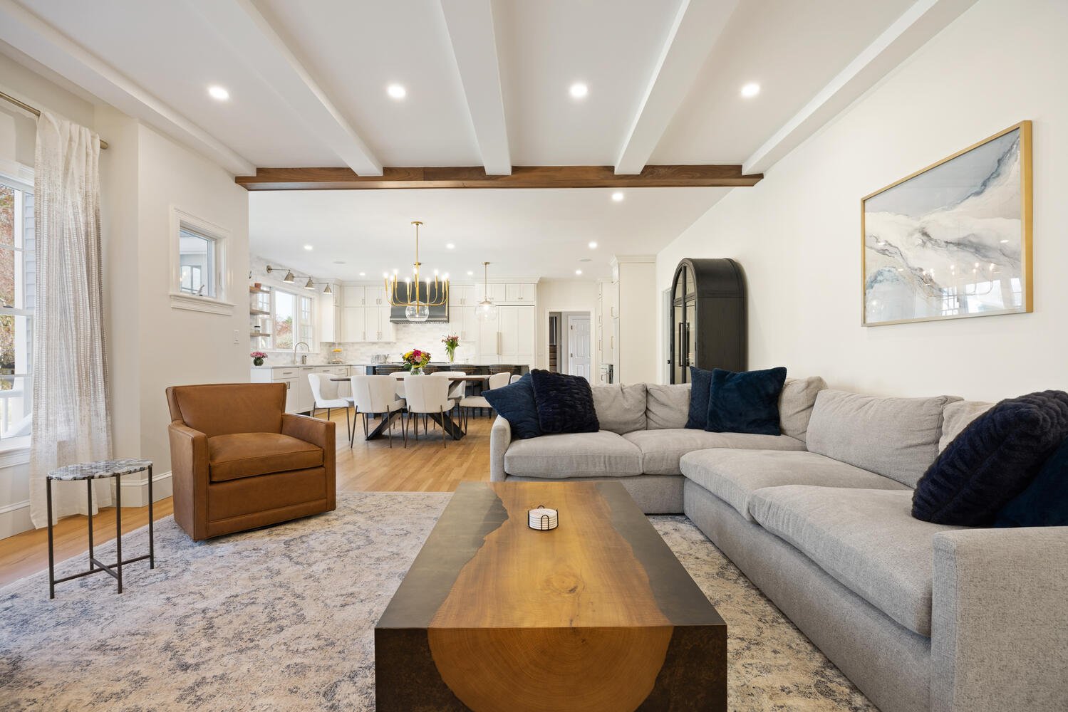 Bright open-concept living space in Lexington, MA by Pegasus Design-to-Build featuring a kitchen, dining area, and seating Bright open-concept living space in Lexington, MA by Pegasus Design-to-Build featuring a kitchen, dining area, and seating
