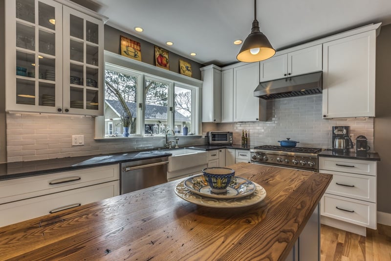 Kitchen remodel in Melrose, MA by Pegasus Design-to-Build with farmhouse sink and wood island-optimized