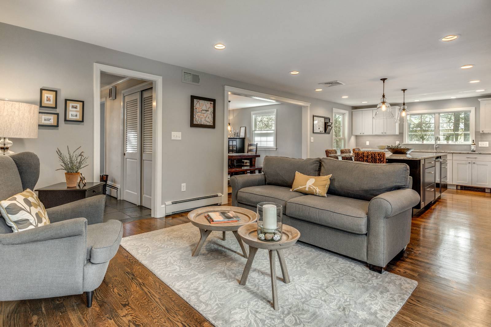 Whole house remodel in Lexington, MA by PEGASUS Design-to-Build showcasing open layout living room flowing into updated kitchen-optimized