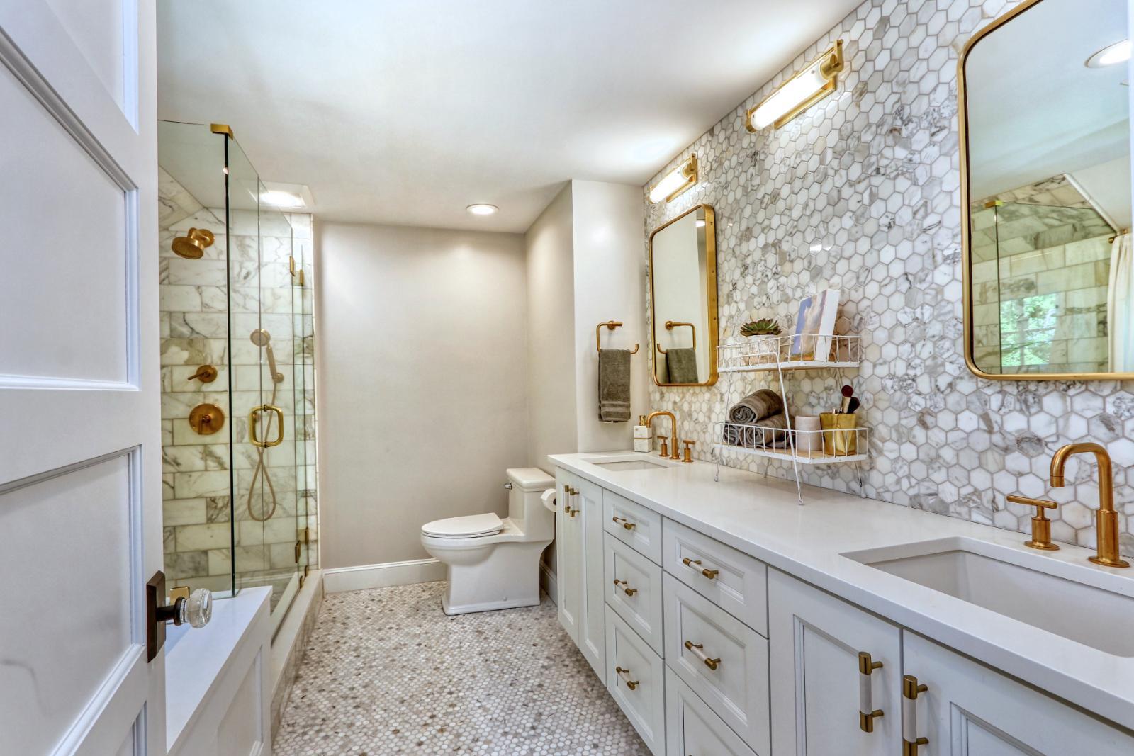 Elegant bathroom design in Melrose, MA by PEGASUS Design-to-Build with dual sinks and walk-in shower.-optimized