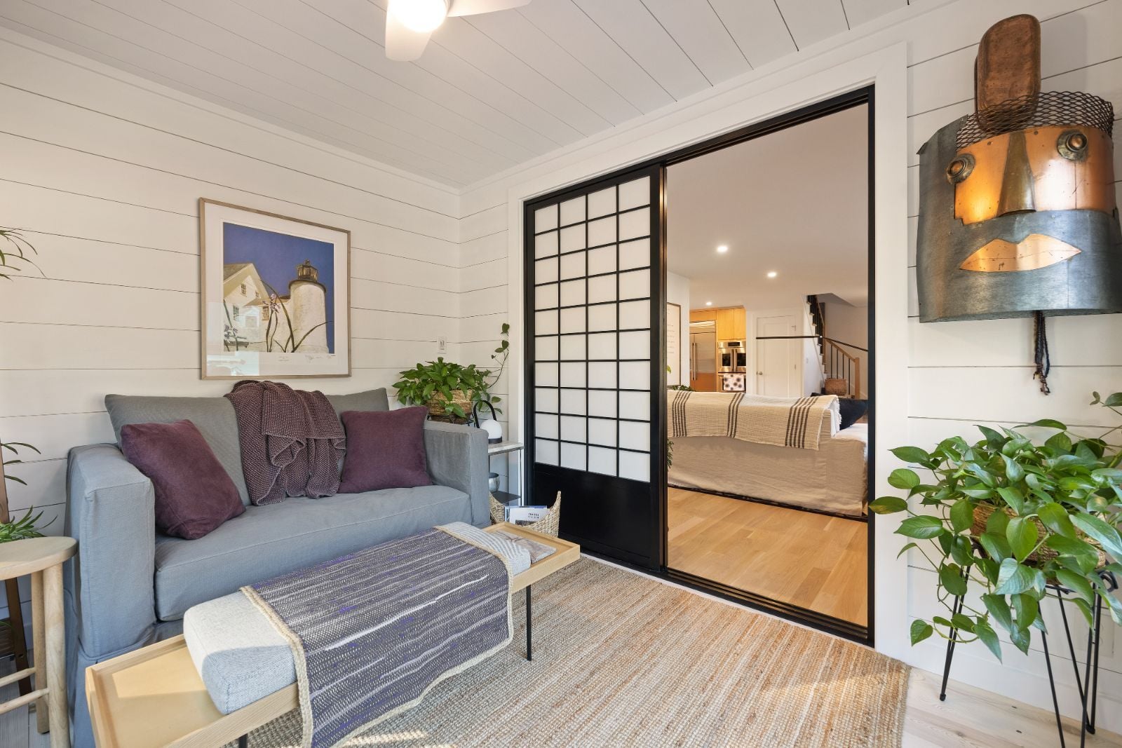 Sunroom with sliding doors connecting to living space by PEGASUS Design-to-Build in Melrose, MA kitchen and addition renovation-optimized