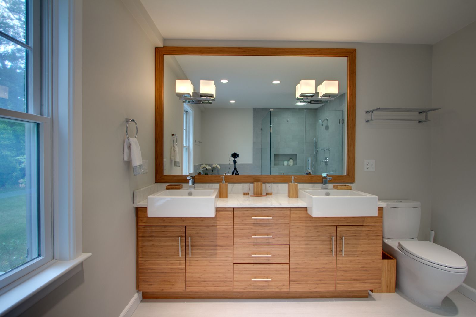 Double sink vanity with large mirror in North Shore MA bathroom by PEGASUS Design-to-Build-optimized