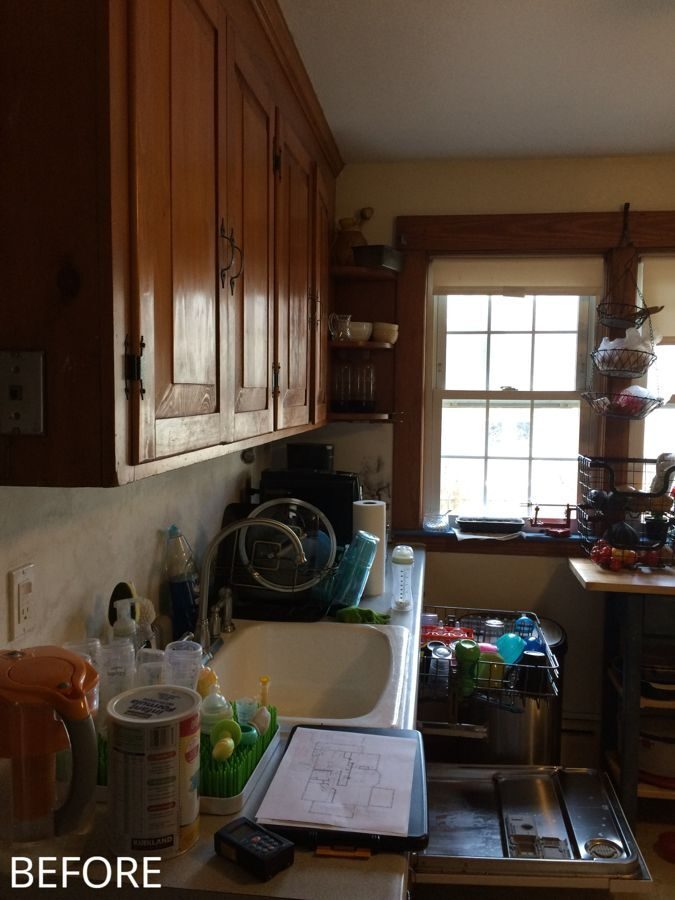 Before: Sink wall: the small sink and dark wood cabinets became a farmhouse sink under a raised window, with open wood shelves and arabesque tile.
