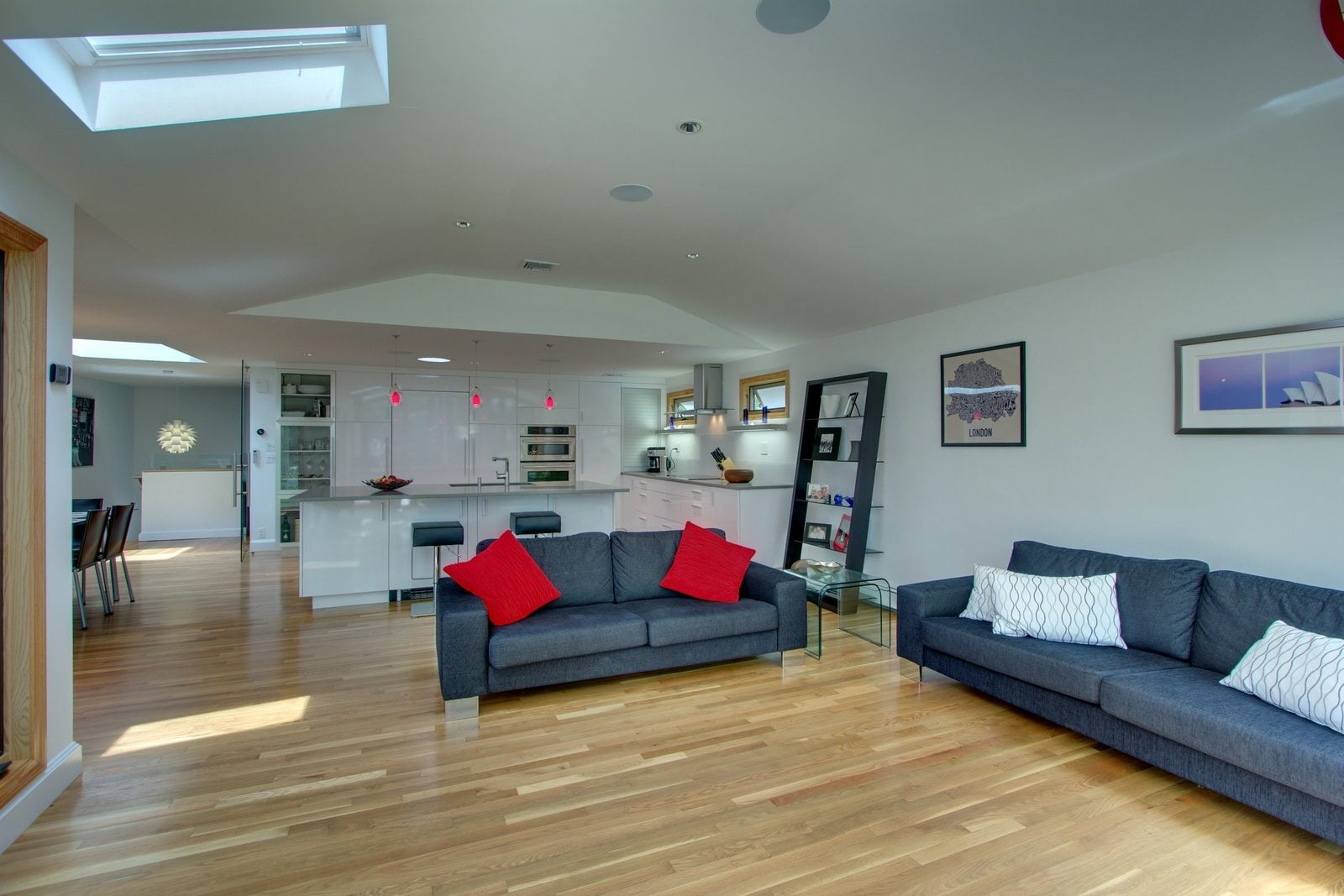 Family room looking back to the open modern kitchen and island in Arlington, MA