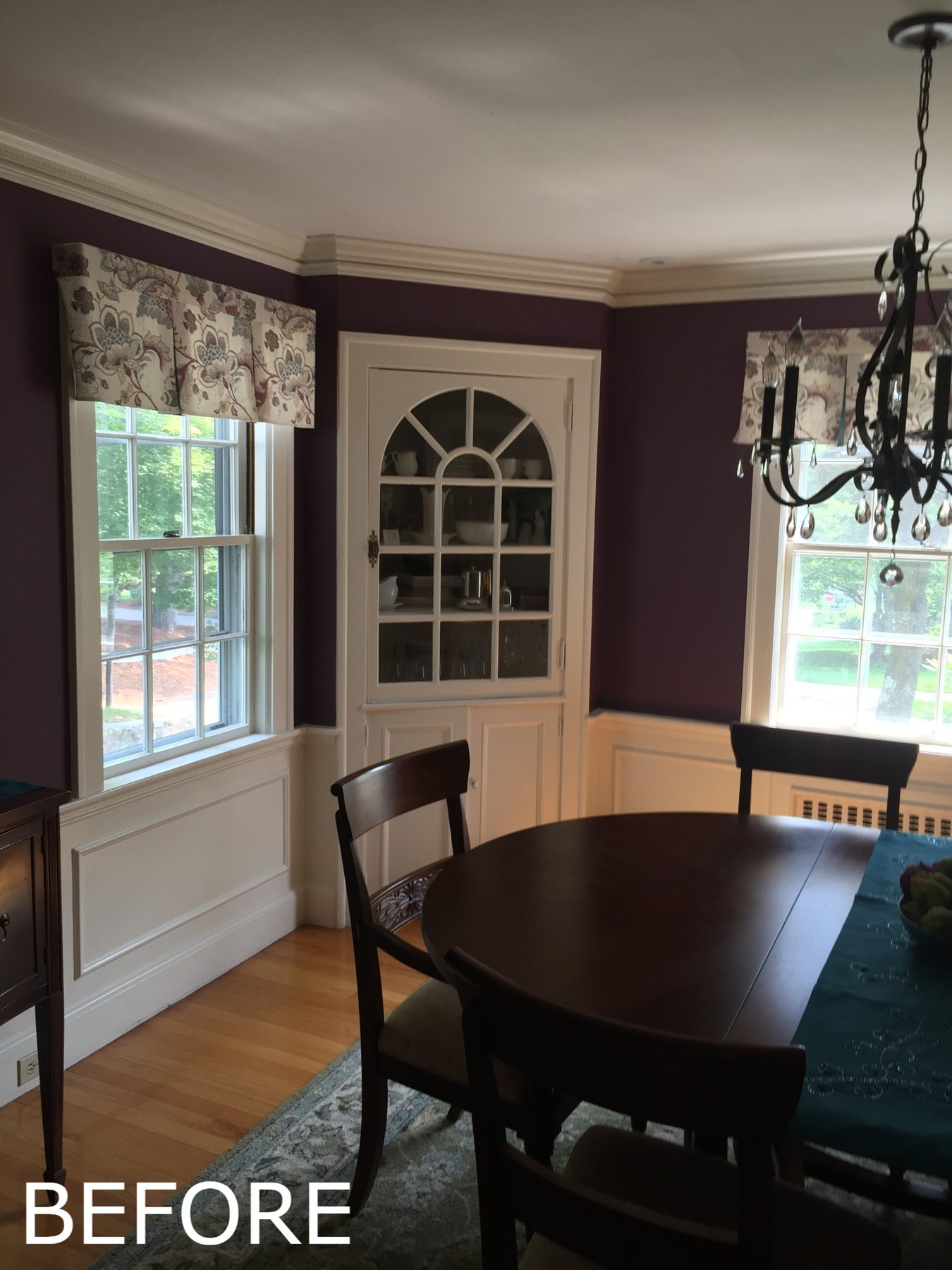 Before: Dining room: dark walls and a closed-off feel gave way to light paint and an open connection to the new kitchen, with the original arched corner cabinet kept.