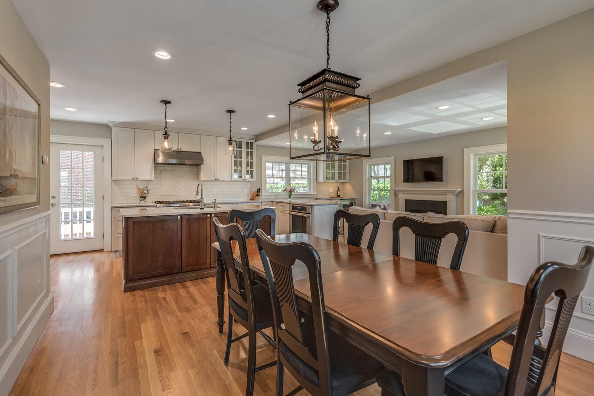 After: Dining room: a single door into a closed-off kitchen became a wide-open view to the new island kitchen and family room.