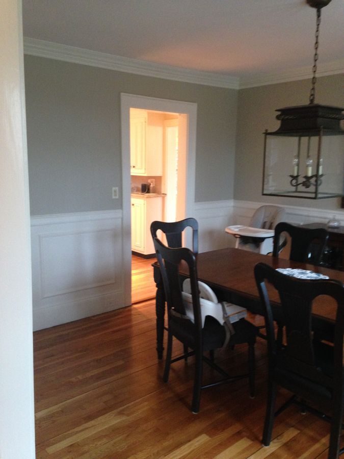Before: Dining room: a single door into a closed-off kitchen became a wide-open view to the new island kitchen and family room.