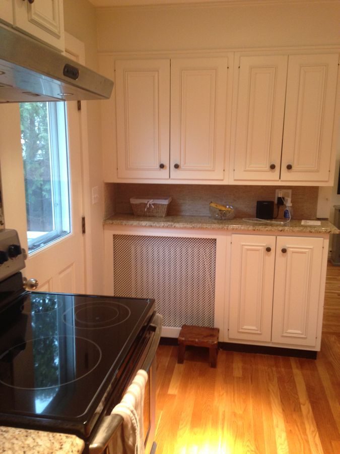 Before: Kitchen: the old electric range by the back door gave way to a full-glass door to the new deck, a pro-style gas range and a subway backsplash with a herringbone panel.