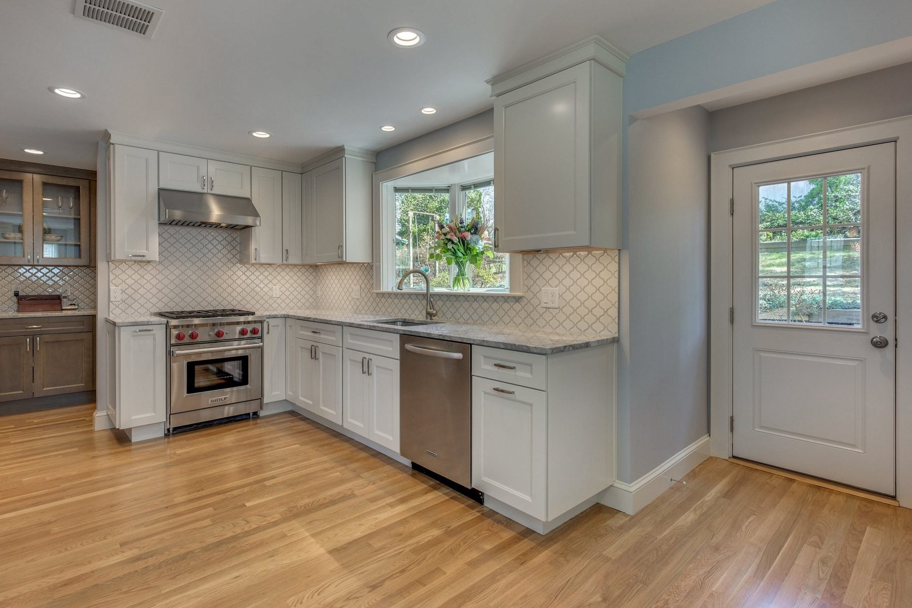 White kitchen with a bay window in Belmont