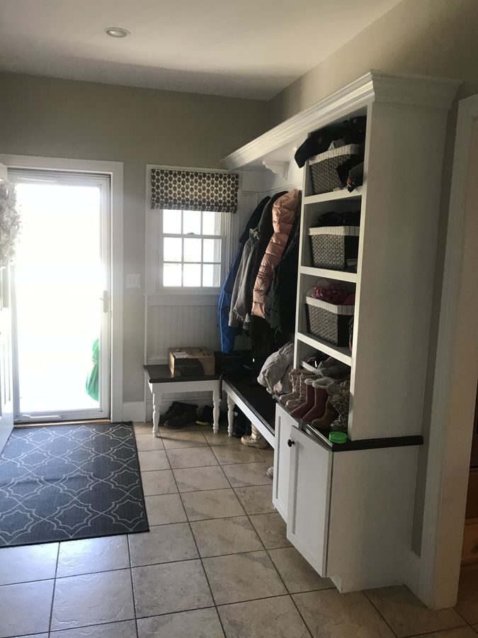 Before: Mudroom: the narrow back entry became a mudroom with built-in cubbies and a butcher-block bench.